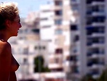 Cute topless British girl on beach