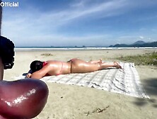 Large butt showing her booty in a micro bikini