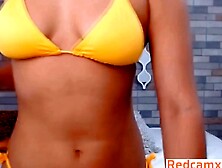 Exotic Babe With Curly Hair And A Big Ass Strips Her Bikini On Camera