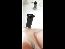 MILF Plays in the Tub with a Big Dildo