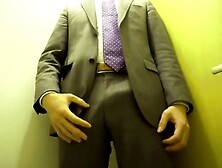 Suit-Clad Man Jerking Off While Standing