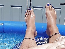 Showing off our pedicured toes in the back yard pool