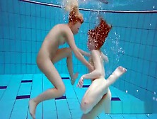 Milana And Katrin Strip Eachother Underwater