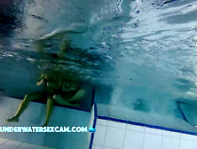 Sporty Couple Regenerating On An Underwater Bench