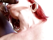 Redhead mature lady is fucked on the couch by a black stud