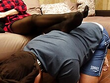 A Slave in a Collar is Kneeling Legs in Dark Socks and Tights