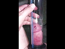 Pumping a pierced cock