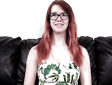 Redhead young babe Ariel opens her shaved pussy on the camera