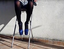 Denim shorts,  ebony tights and glamorous 8 inch heels