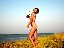 Sexy Gentle Black-Haired Lady Fills In The Beauty Of The Ocean With Her Tremendous Features