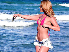 Sexy blonde Abby Cross takes a selphie on the beach