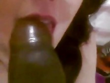 Girl Has Fun With A Black Dildo