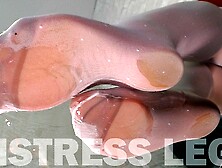 White Stockings Over Flesh-Colored Pantyhose Teasing On The Glass Table