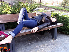 Barefoot brunette takes off nylons,  shows feet in a park