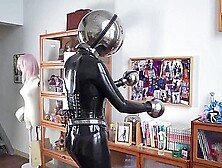 Girl In Latex And Metal And Chastity Belt With Vibrator