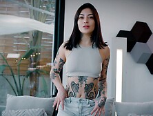 A hot brunette,  Tabatha Lust,  in short jeans shorts,  shows her body