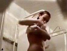 Two seductive coeds enjoy washing their tasty bodies