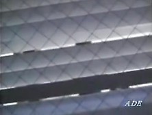 Peeping window movie in which an asian whore masturbates