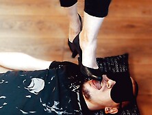 Slave sucks and cleans mistress's shoes while lying at her feet, russian femdom, foot worship