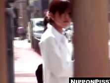 Sultry Asian in knee socks hunts quiet spot for urgent piss