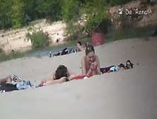 Beach video of shy topless girl sunbathing