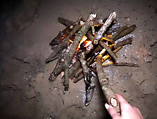 Bj and doggy on the beach at night by the fire