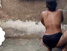 My relative's housewife is taking bath in the open bathroom wearing black underwear at my house