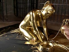 Hot slave girl painted in gold loves playing with a throbbing dick