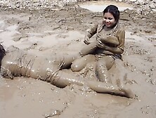 two thai girls in mud