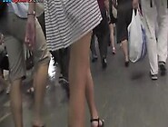 Upskirt video of an auburn-hair cougar with g-string