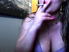 hot busty babe smoking while tease for camera