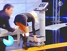 Blonde woman with big juggs gives the audience an eyeful of her melons and ass