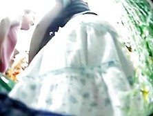 Green And White Flowery Mini Skirt In Voyeur's Vid