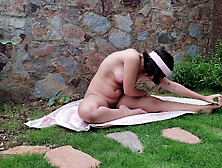 Latina teen doing yoga naked outdoors