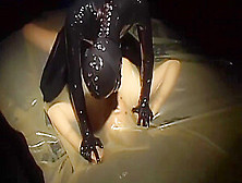 Two Sexy Lesbians Full Encased In Latex Suits Have Fun In Her Rubber Skins And Vacuum Bed - 2