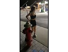 Girl Pisses On Hydrant Like A Dog