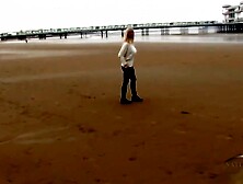 Breasty blond woman is gently rubbing her highly hirsute vagina,  in front of the camera