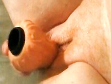 Granny masturbates with a sex toy in bathtub