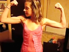 Bridget flexing her biceps