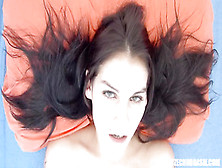 Dark haired sweetheart rubs her pierced pussy passionately