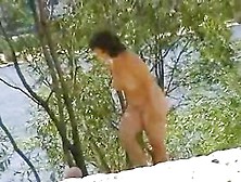 Mature lady with nice natural tits naked on beach