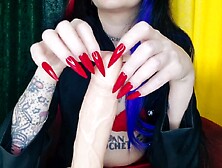 Red sharp lengthy nails. Nail fetish shows on sex toy.