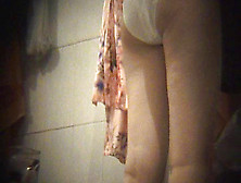 Busty babe is wiping her shaved pussy with pleasure