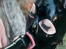 Strapon dildo blowjob in latex fetish video