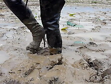 Two thai in thigh boots swim in mud!!!