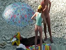 Nudist couple goes take a swim