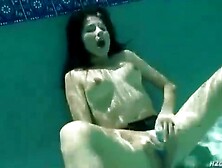 Puny boobed,  German brown-haired is jerking in the swimming pool,  in the middle of the day