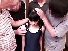 Tiny Japanese teen squirts during bukkake