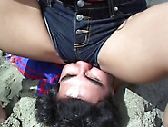 Clothed facesitting on the beach