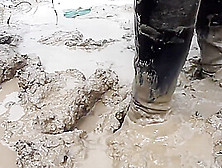 two thai swim in mud